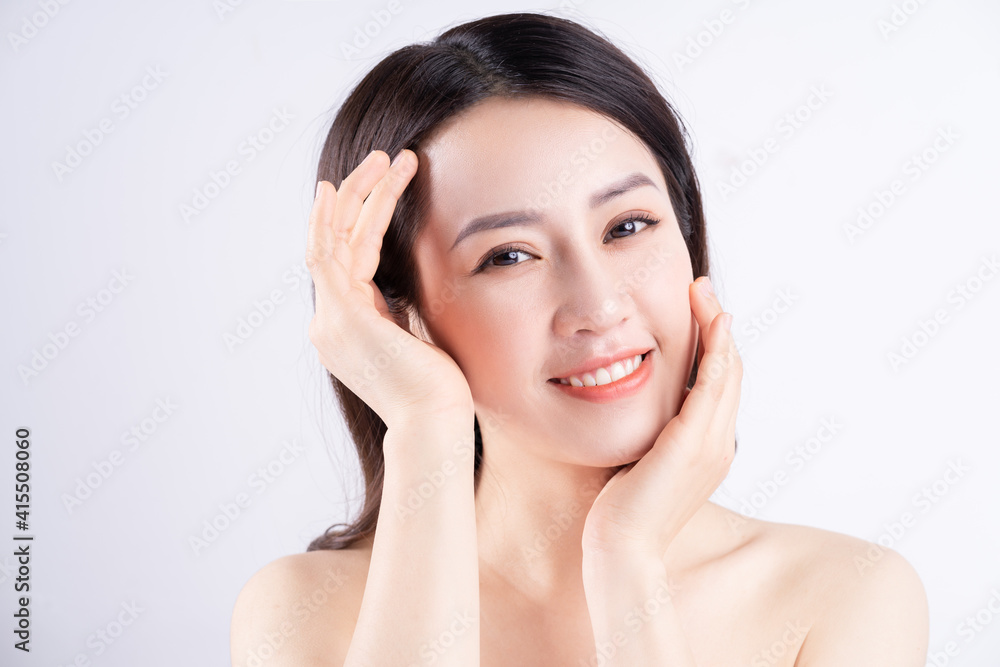 Beautiful xing woman with fresh skin smiling on background Beautiful xing woman with fresh skin smiling on background