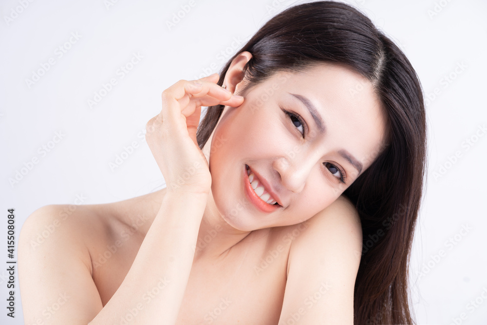 Beautiful xing woman with fresh skin smiling on background Beautiful xing woman with fresh skin smiling on background