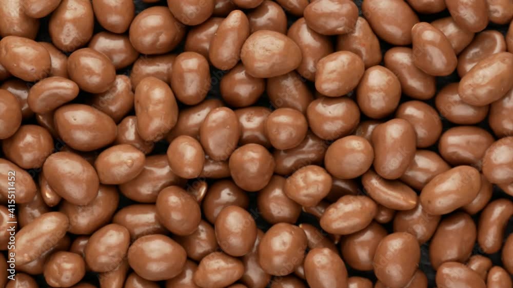 Chocolate nuts, top view. Glazed peanuts, dolly shot. Chocolate nuts, top view. Glazed peanuts, dolly shot.