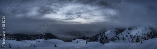 Panoramic View of Canadian Nature Landscape covered in fresh white Snow during winter sunset. Taken in Seymour Mountain, North Vancouver, British Columbia, Canada. Nature Background Panorama