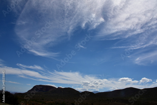 Late afternoon silhouetted Karoo hills with blue sky and cloud patterns © Gerrit Rautenbach