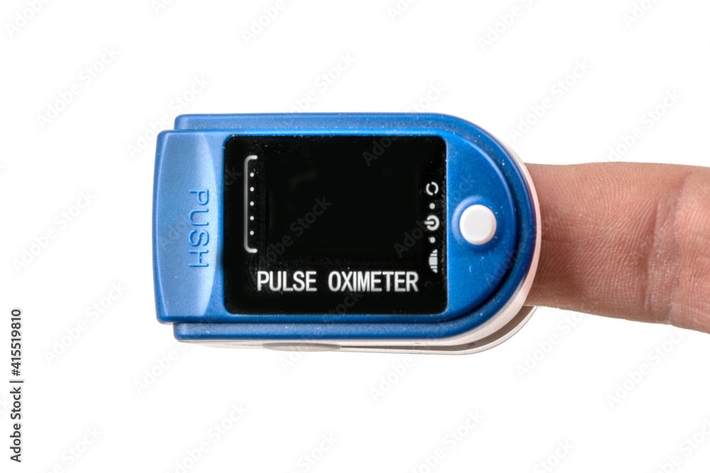 Foto Stock Close up Finger with Pulse Oximeter Measurement. Reduced