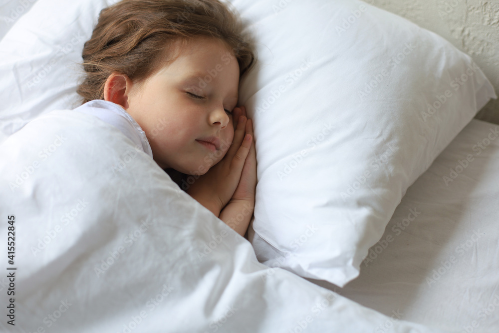 Cute child little girl sleeps in the bed. Cute child little girl sleeps in the bed.