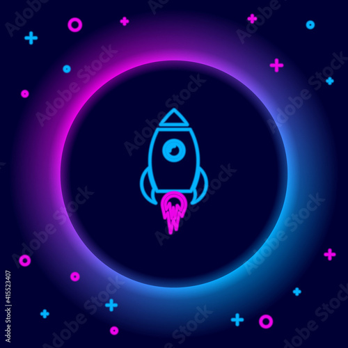 Glowing neon line Rocket ship with fire icon isolated on black background. Space travel. Colorful outline concept. Vector.