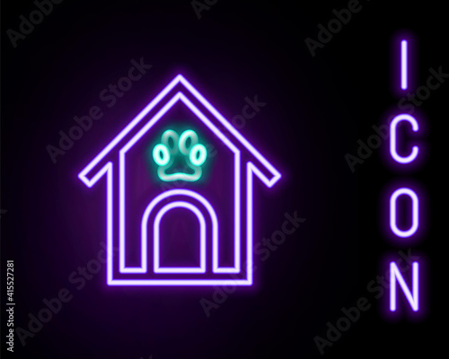 Glowing neon line Dog house and paw print pet icon isolated on black background. Dog kennel. Colorful outline concept. Vector.
