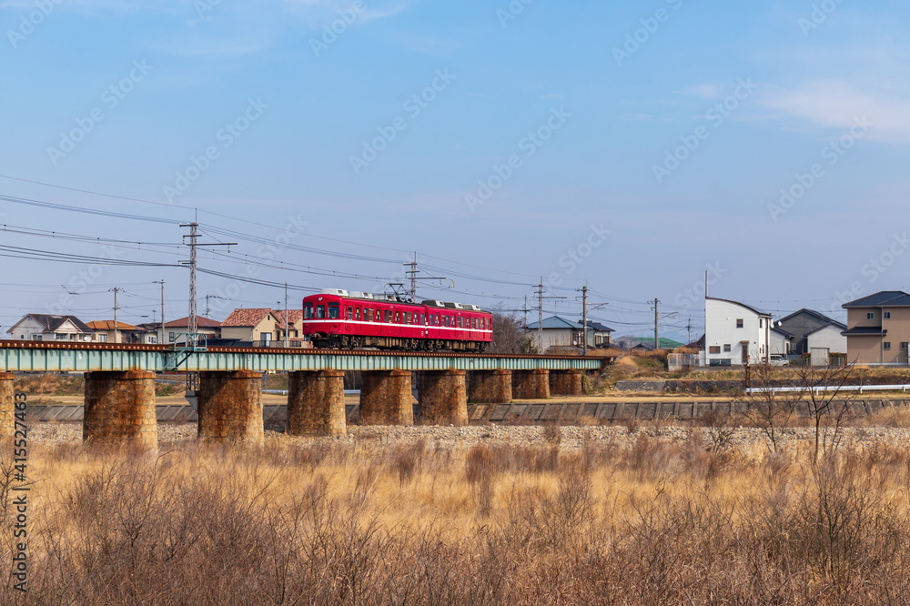 Train running on a railway bridge over the river ,  Takamatsu city, Kagawa, Shikoku, Japan