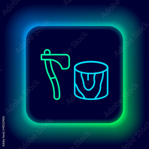 Glowing neon line Wooden axe in stump icon isolated on black background. Lumberjack axe. Axe stuck in wood. Chopping wood. Colorful outline concept. Vector.