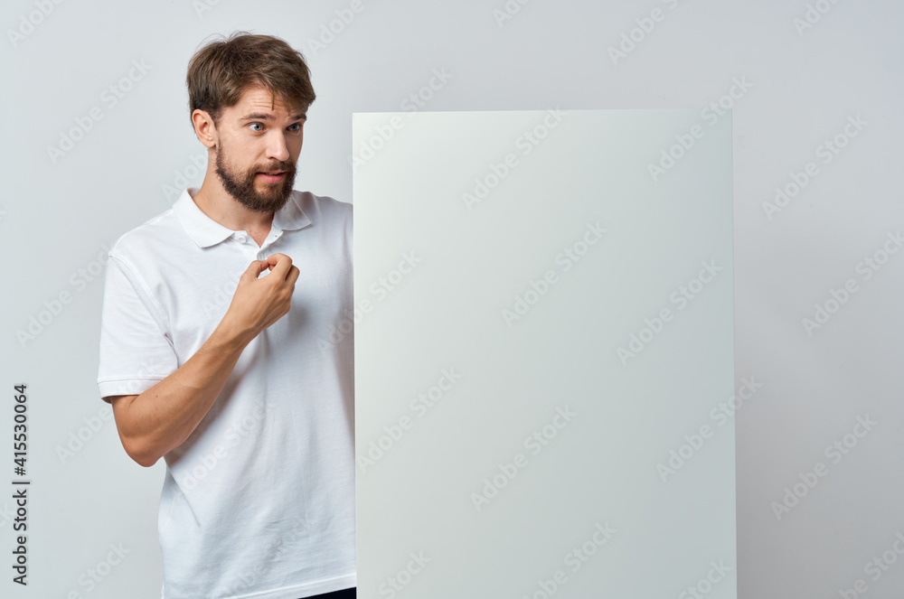 man in white t-shirt white banner advertising isolated background man in white t-shirt white banner advertising isolated background