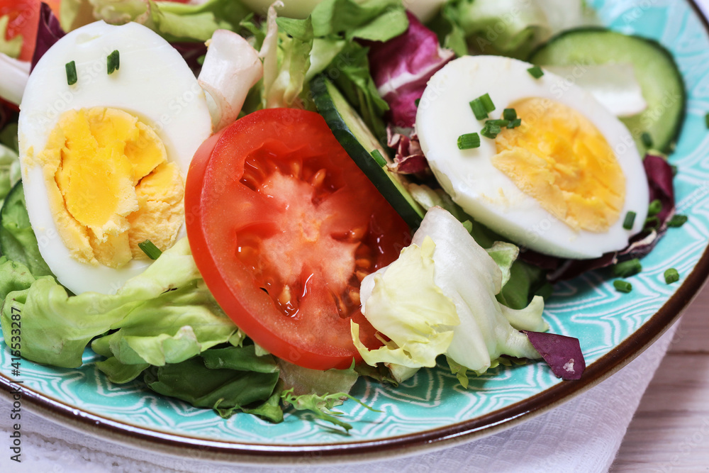 Healthy salad with lettuce, tomatoes and eggs. Healthy salad with lettuce, tomatoes and eggs.