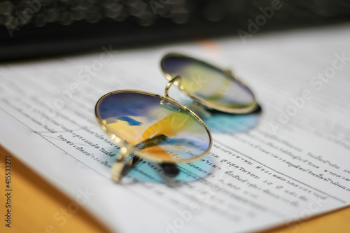 Wallpaper Mural Colourful glasses on the text paper, Selective focus. Torontodigital.ca