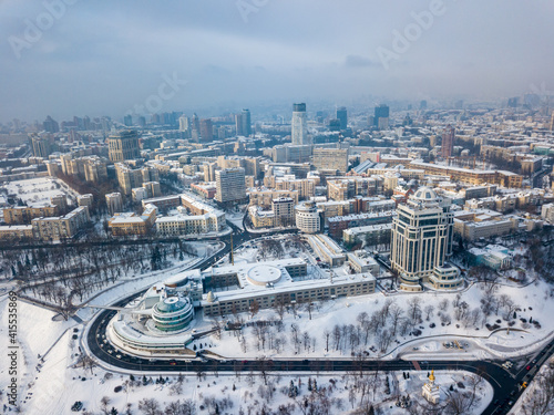 Snowy Kiev in sunny weather. Aerial drone view. Winter frosty morning.
