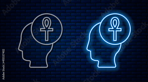 Glowing neon line Cross ankh icon isolated on brick wall background. Vector.