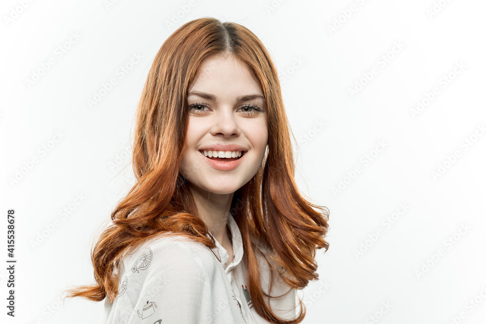 attractive red-haired woman cosmetics light background model
