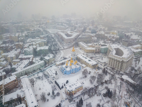 St. Michael's Cathedral in Kiev in a blizzard. Aerial drone view. Snowy winter morning, blizzard.