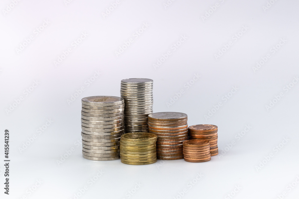 aving money concept preset by Thai coins stacked like income graph. coins arranged as a graph isolated on white background. aving money concept preset by Thai coins stacked like income graph. coins arranged as a graph isolated on white background.