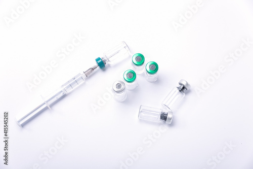 syringe and medicine bottles. Influenza vaccine