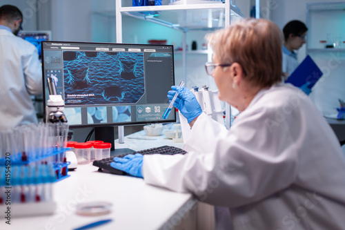 Tableau sur toile Biotechnologist senior scientist researching with test tube in pharma lab