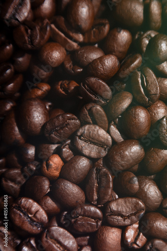 coffee beans lie on the background arabica