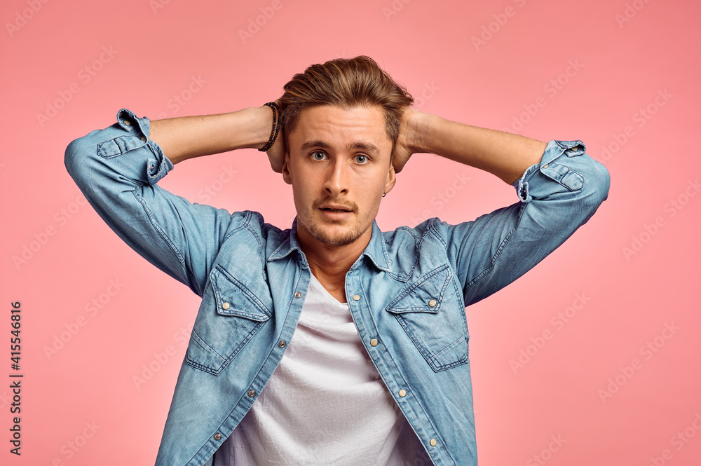 Stressed man portrait, pink background, emotion Stressed man portrait, pink background, emotion