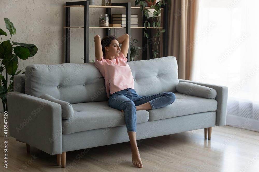 Calm serene pretty arabian woman rest relax on couch at home breath fresh air meditate enjoy free time on weekend. Peaceful young indian lady dreaming on sofa at modern living room nap relieve stress Calm serene pretty arabian woman rest relax on couch at home breath fresh air meditate enjoy free time on weekend. Peaceful young indian lady dreaming on sofa at modern living room nap relieve stress
