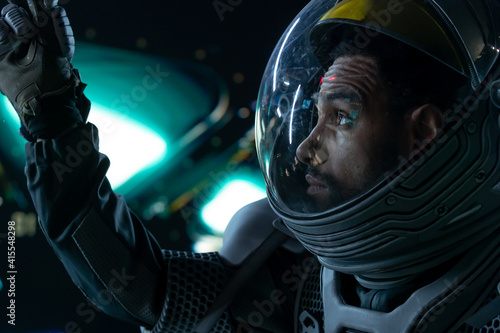 Fotografie, Obraz Portrait of African American Black male astronaut inside spaceship cockpit