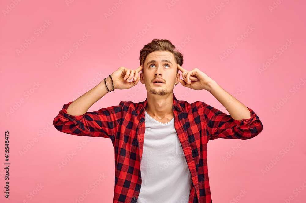 Focused man with a fingers at his temples, emotion Focused man with a fingers at his temples, emotion