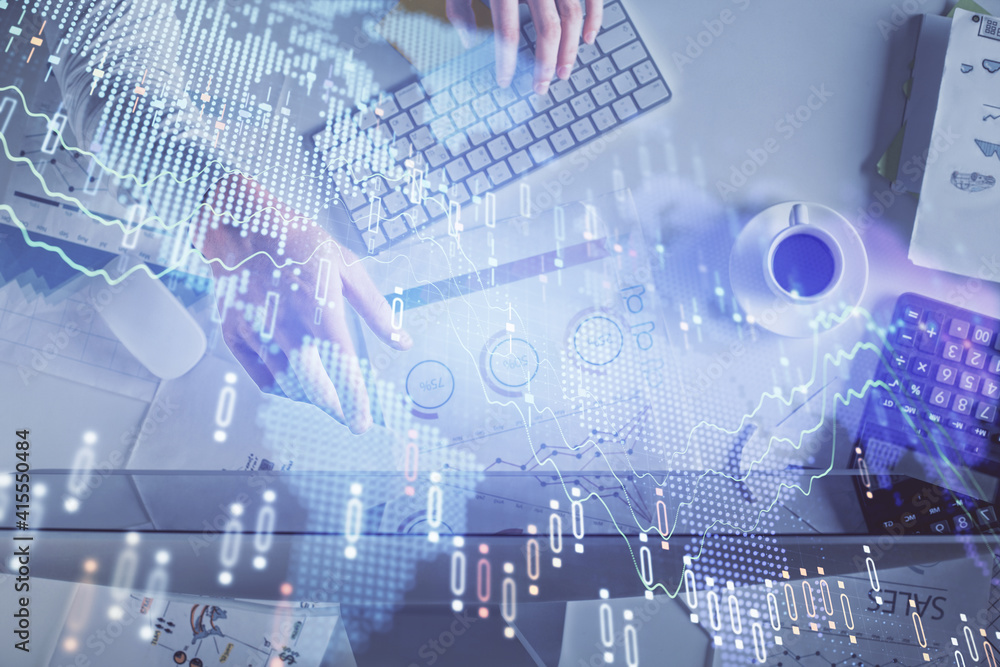 Multi exposure of man's hands typing over computer keyboard and forex graph hologram drawing. Top view. Financial markets concept. Multi exposure of man's hands typing over computer keyboard and forex graph hologram drawing. Top view. Financial markets concept.