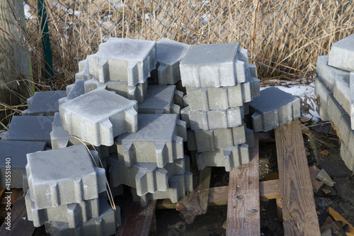 Pavement-Stacks of new concrete paving slabs on wooden pallets