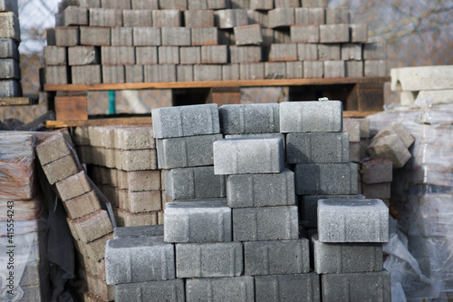 Pavement-Stacks of new concrete paving slabs on wooden pallets