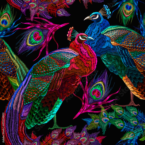 Embroidery peacocks, tropical birds seamless pattern. Fashionable template for design of clothes. Tails of peacocks art