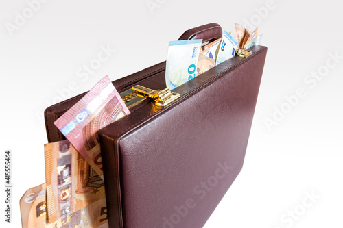 Closed 24 hour briefcase with euro banknotes coming out photo