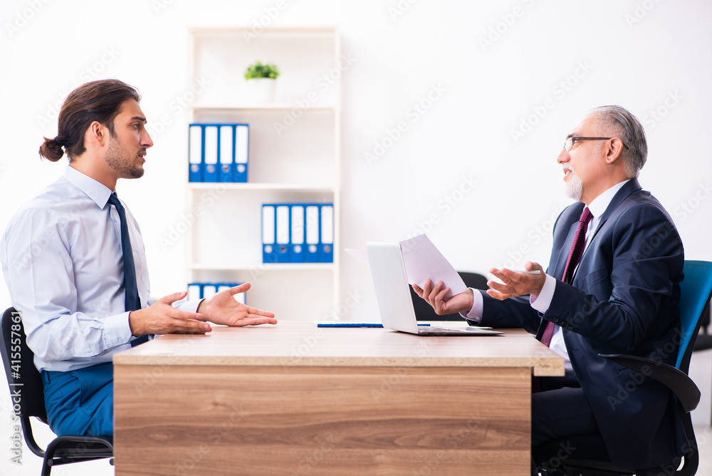 Young male candidate employee meeting with old recruiter Young male candidate employee meeting with old recruiter