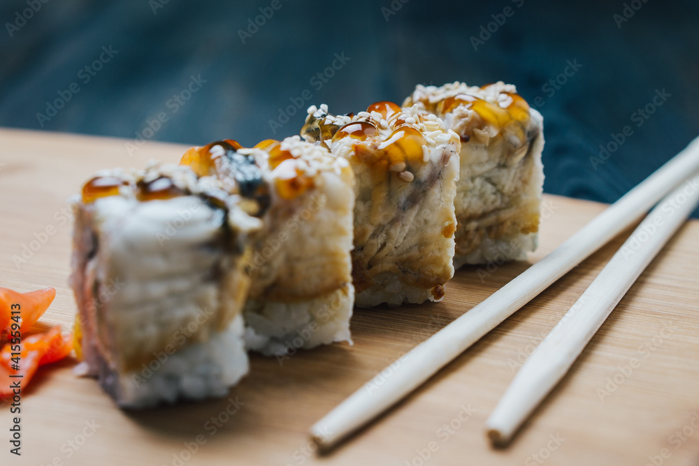 sushi chopsticks ginger red on a wooden board snack sushi chopsticks ginger red on a wooden board snack