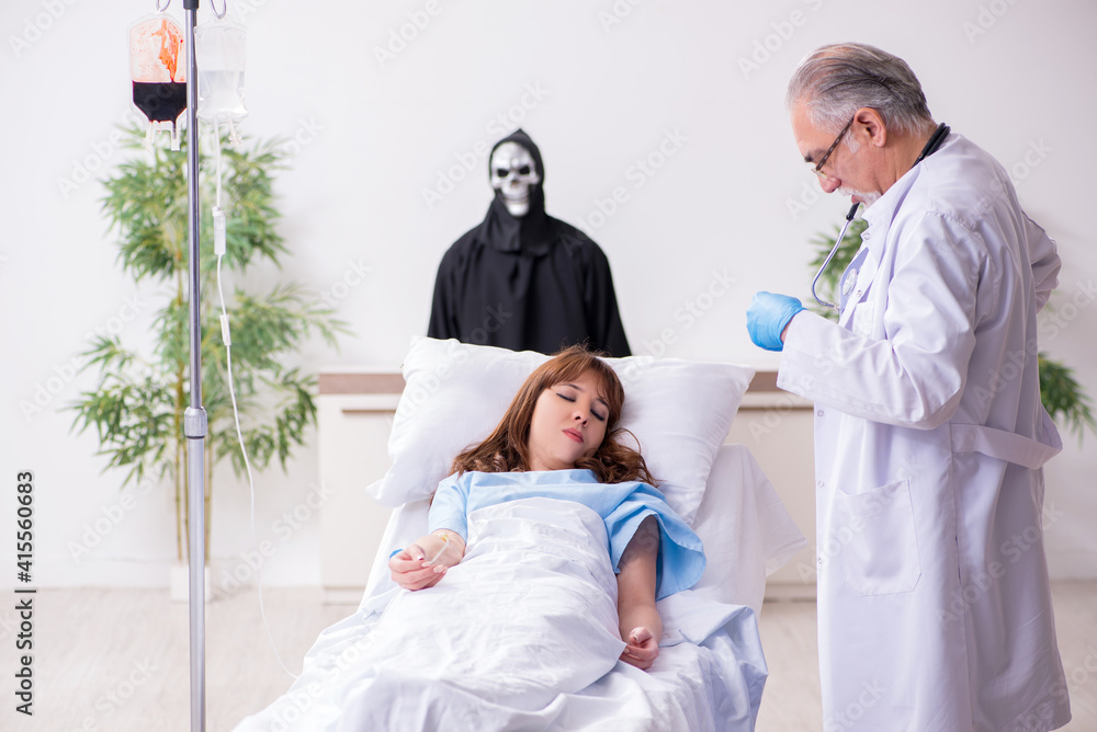 Devil, old doctor and female patient in the clinic Devil, old doctor and female patient in the clinic