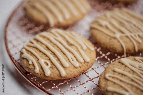 Closeup of spiced cookies with beige maple icing