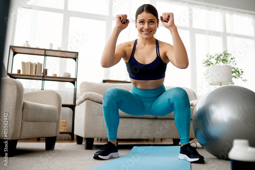 Slim woman doing exercise, online pilates training