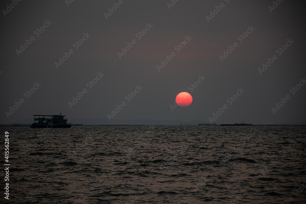Picture of the atmosphere during the sunset with the beautiful sea and the light began to run Reflected on the sea surface beautiful Picture of the atmosphere during the sunset with the beautiful sea and the light began to run Reflected on the sea surface beautiful