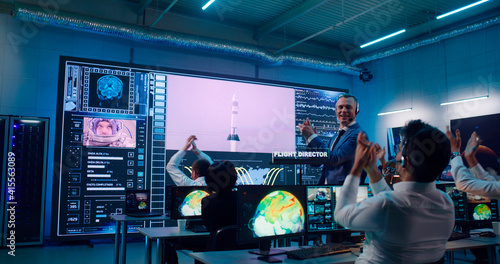 Fototapeta Boss congratulating operators with successful spacecraft launch