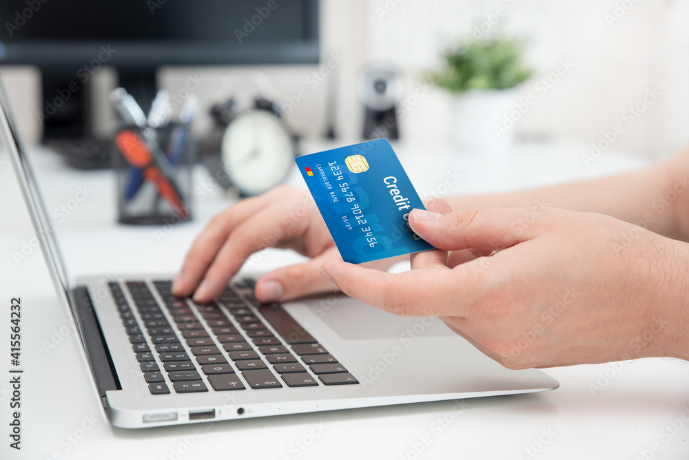 Online shopping, e-commerce. Credit card in hand. Online shopping, e-commerce. Credit card in hand.