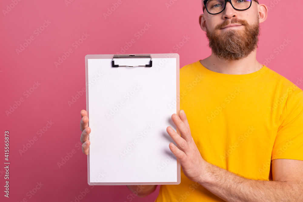 young man look out eyes white empty blank billboard for promotional content isolated studio shot young man look out eyes white empty blank billboard for promotional content isolated studio shot