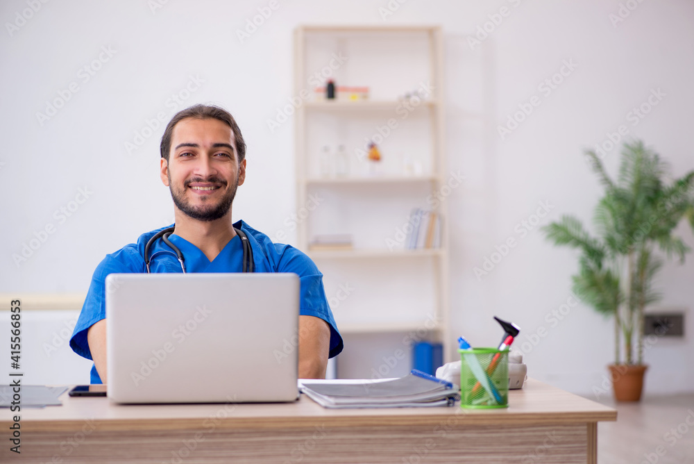 Young male doctor in telemedicine concept Young male doctor in telemedicine concept