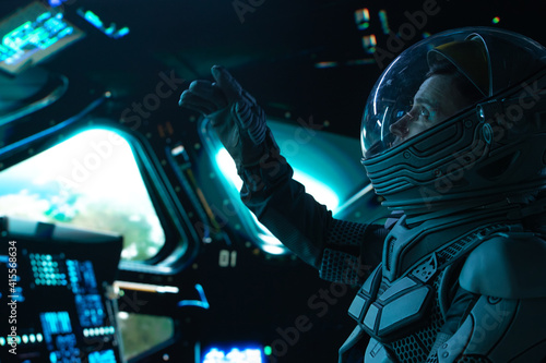 Fényképezés Portrait of Caucasian male astronaut inside spaceship cockpit