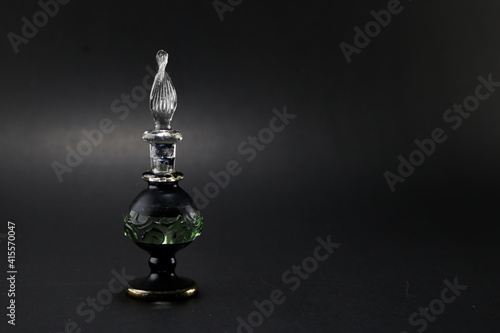 Arabian Fragrance bottle on isolated black background © SalmanArif