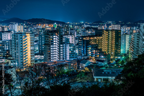 日本の地方都市、福岡市愛宕神社から望む夜景の美しいビル街の灯りと街並み photo