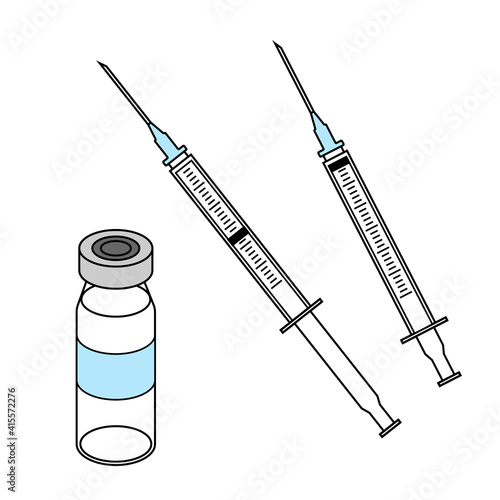 Syringes and a vaccine bottle