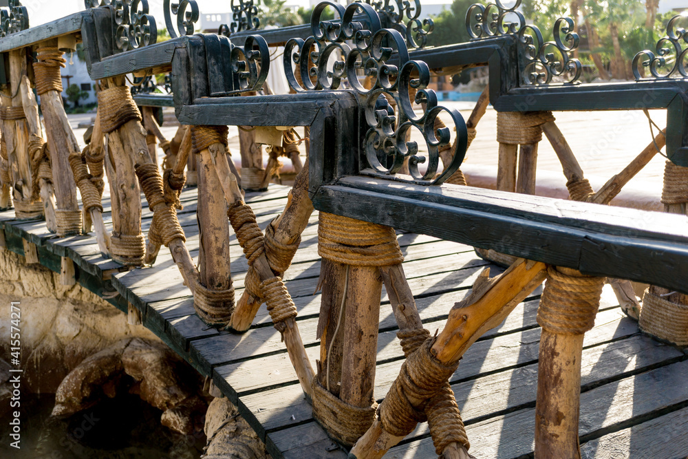 Beautiful old wooden bridge at the park Beautiful old wooden bridge at the park