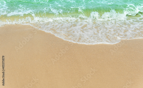Fototapeta Naklejka Na Ścianę i Meble -  Sand beach seaside with white foamy blue wave from the sea