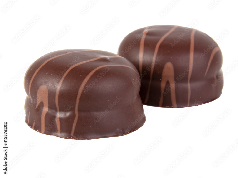 Cookie in chocolate glaze with mousse filling isolated on the white Cookie in chocolate glaze with mousse filling isolated on the white