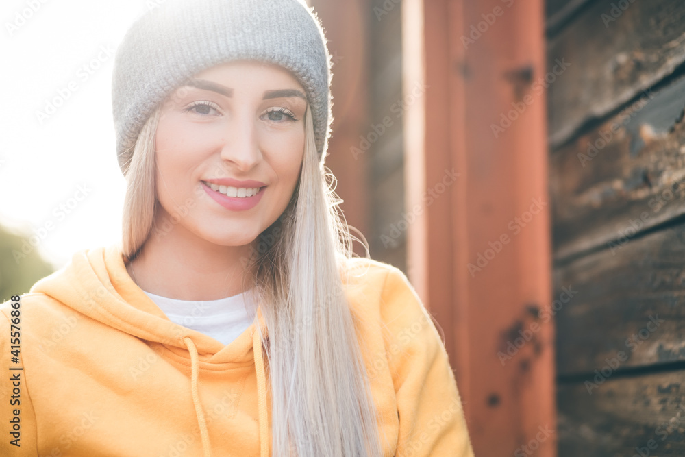 Close-up beautiful young woman with smile face looking at camera. Outdoors daylight. Cute girl wearing casual clothing. Close-up beautiful young woman with smile face looking at camera. Outdoors daylight. Cute girl wearing casual clothing.