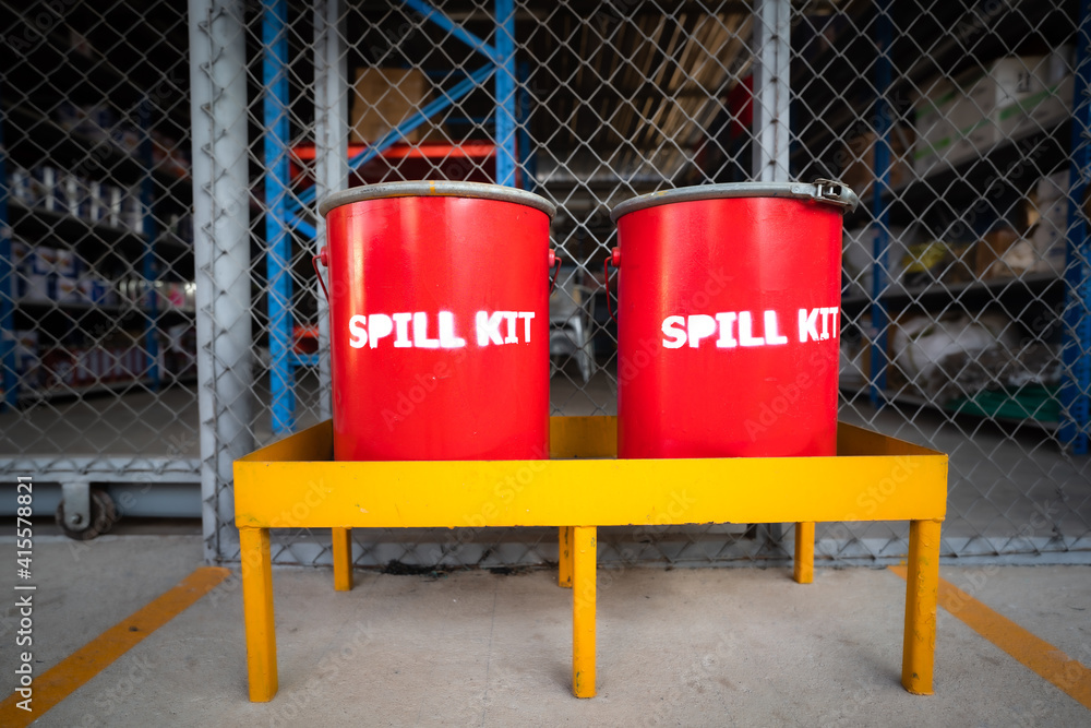 Spill kit containment boxes are prepared and placed in front of the